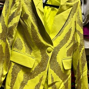 This is a one of kind blazer with rhinestones on a beautifully designed piece.
